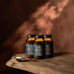 Three jars of ‘Wild Collagen' on a wooden surface with a warm brown background