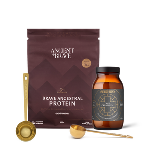 Brave Ancestral Protein packaging with a jar of True Creatine+ and two Ritual Scoops on a blank background
